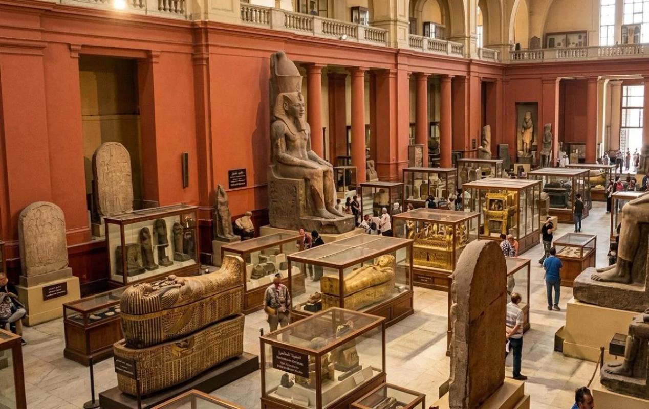 Interior hall of the Egyptian Museum in Tahrir showing ancient pharaonic statues and artifacts on a private guided tour